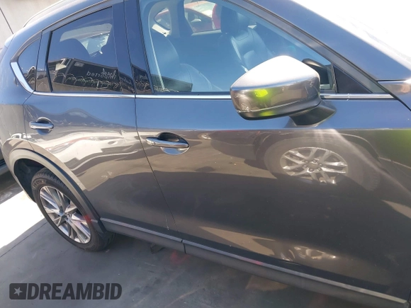 2020 Mazda CX-5 Grand Touring with VIN JM3KFADM3L1812649, listed as a IAAI auction lot 42575393 with 102,118 mi miles and . Bid and sale history available at DreamBid. Image 14.