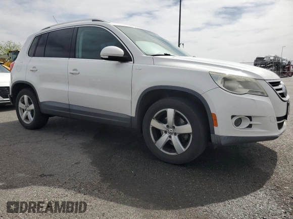 2010 Volkswagen Tiguan Wolfsburg Edition with VIN WVGAV7AX7AW003188, listed as a Copart auction lot 56692535 with 121,502 mi miles and Salvage title. Bid and sale history available at DreamBid. Image 4.