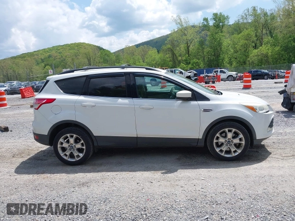 2013 Ford Escape SE with VIN 1FMCU0G90DUB37052, listed as a IAAI auction lot 42132973 with 169,975 mi miles and . Bid and sale history available at DreamBid. Image 13.