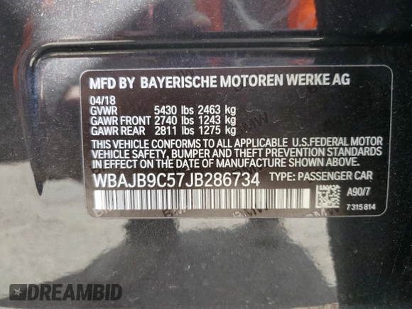 2018 BMW 5 Series M550i xDrive with VIN WBAJB9C57JB286734, listed as a Copart auction lot 52711235 with 127,450 mi miles and Salvage title. Bid and sale history available at DreamBid. Image 12.