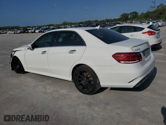 2014 Mercedes-Benz E 350 Sport with VIN WDDHF5KB5EA967675, listed as a Copart auction lot 52763995 with 68,902 mi miles and Salvage title. Bid and sale history available at DreamBid. Image 2.