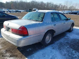 1998 Mercury Grand Marquis LS with VIN 2MEFM75W2WX657976, listed as a IAAI auction lot 41418388 with 102,093 mi miles. Bid and sale history available at carsss.com. Image 4.