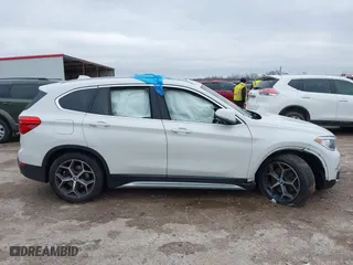2019 BMW X1 xDrive28i with VIN WBXHT3C51K5L90392, listed as a IAAI auction lot 41571403 with 96,732 mi miles. Bid and sale history available at carsss.com. Image 13.