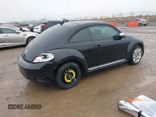 2013 Volkswagen Beetle 2.5L w/Sun/Sound/Nav with VIN 3VWJX7AT1DM686146, listed as a IAAI auction lot 41444277 with 92,964 mi miles and . Bid and sale history available at DreamBid. Image 4.