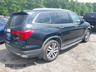 2017 Honda Pilot Touring with VIN 5FNYF5H99HB037126, listed as a IAAI auction lot 42275048 with 164,289 mi miles and . Bid and sale history available at DreamBid. Image 4.