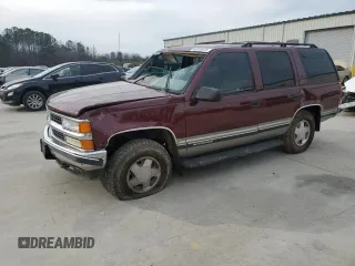 1999 Chevrolet Tahoe Z71 with VIN 1GNEK13R0XJ560287, listed as a Copart auction lot 46919975 with 236,807 mi miles and Salvage Title. Bid and sale history available at DreamBid. Image 1.