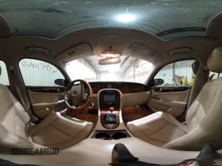 2004 Jaguar XJ with VIN SAJWA71C04SG33993, listed as a IAAI auction lot 41193040 with 79,944 mi miles. Bid and sale history available at carsss.com. Image 18.