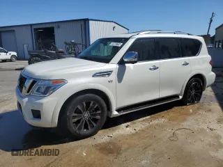 2019 Nissan Armada Platinum z VIN JN8AY2NE1K9758154, wystawiony jako Copart lot #50966725 z przebiegiem 142 691 mil mil oraz Czysty tytuł • Clean title. Historia ofert i sprzedaży dostępna na DreamBid. Obrazek 1.