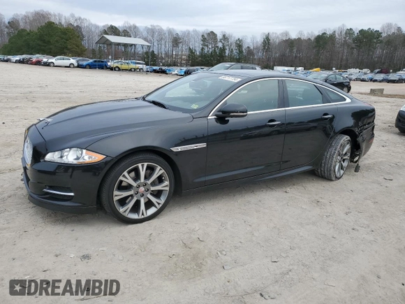 2015 Jaguar XJ with VIN SAJWA1CZ1F8V85402, listed as a Copart auction lot 86717734 with 201,249 mi miles and Salvage Title. Bid and sale history available at carsss.com. Image 1.