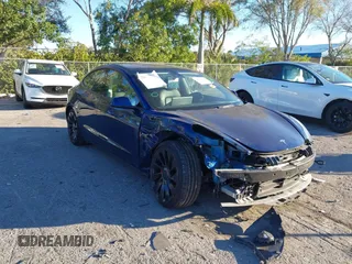 2023 Tesla Model 3 Performance with VIN 5YJ3E1EC4PF404521, listed as a IAAI auction lot 41274669 with 49,299 mi miles. Bid and sale history available at carsss.com. Image 1.