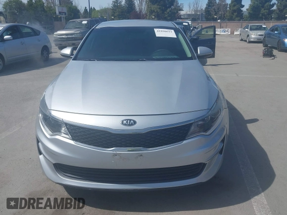 2018 Kia Optima LX with VIN 5XXGT4L31JG267716, listed as a IAAI auction lot 41890611 with 63,491 mi miles and . Bid and sale history available at carsss.com. Image 12.