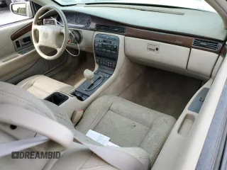 1999 Cadillac Eldorado z VIN 1G6EL12Y7XU615169, wystawiony jako Copart lot #76459744 z przebiegiem Nie podano mil oraz Szkoda całkowita • Salvage title. Historia ofert i sprzedaży dostępna na DreamBid. Obrazek 8.