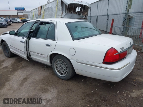 2001 Mercury Grand Marquis GS z VIN 2MEFM74W81X612809, wystawiony jako IAAI lot #41697200 z przebiegiem 160 423 mil mil oraz . Historia ofert i sprzedaży dostępna na DreamBid. Obrazek 3.
