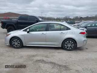 2020 Toyota Corolla Hybrid LE with VIN JTDEBRBE1LJ008409, listed as a IAAI auction lot 41948940 with 102,402 mi miles. Bid and sale history available at carsss.com. Image 14.