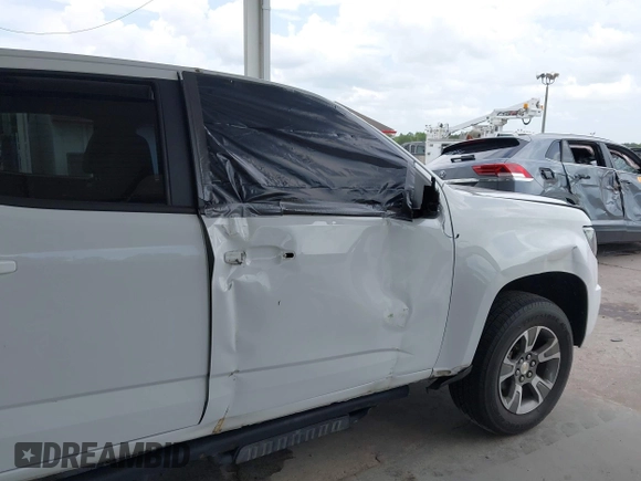 2020 Chevrolet Colorado 2WD Z71 with VIN 1GCGSDEN2L1159458, listed as a IAAI auction lot 42412924 with 90,011 mi miles and . Bid and sale history available at DreamBid. Image 12.