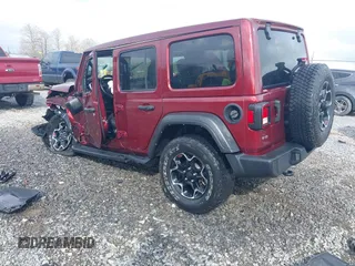 2021 Jeep Wrangler Unlimited Willys with VIN 1C4HJXDN8MW714976, listed as a IAAI auction lot 42080856 with 74,613 mi miles and . Bid and sale history available at DreamBid. Image 3.