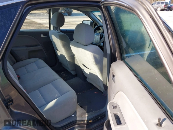 2005 Ford Five Hundred SE z VIN 1FAFP231X5G145153, wystawiony jako IAAI lot #42059747 z przebiegiem 59 114 mil mil oraz . Historia ofert i sprzedaży dostępna na DreamBid. Obrazek 8.