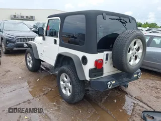 2003 Jeep Wrangler Sport with VIN 1J4FA49S43P362339, listed as a IAAI auction lot 41452901 with 208,128 mi miles and . Bid and sale history available at DreamBid. Image 3.