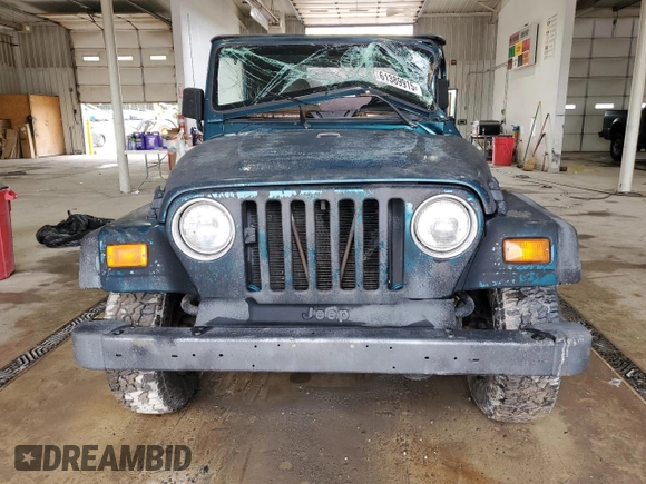 1997 Jeep Wrangler Sport with VIN 1J4FY19SXVP537075, listed as a Copart auction lot 61389915 with Not provided miles and Salvage title. Bid and sale history available at DreamBid. Image 5.