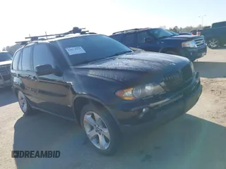 2004 BMW X5 4.4i with VIN 5UXFB53504LV06486, listed as a IAAI auction lot 41674534 with 164,974 mi miles. Bid and sale history available at carsss.com. Image 1.