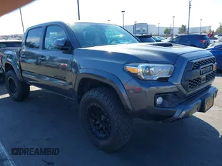 2018 Toyota Tacoma SR5 with VIN 3TMAZ5CN0JM077058, listed as a IAAI auction lot 41685472 with 37,945 mi miles and . Bid and sale history available at DreamBid. Image 1.