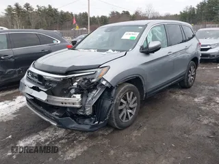 2021 Honda Pilot EX-L with VIN 5FNYF6H57MB010259, listed as a IAAI auction lot 41307012 with 57,849 mi miles. Bid and sale history available at carsss.com. Image 17.