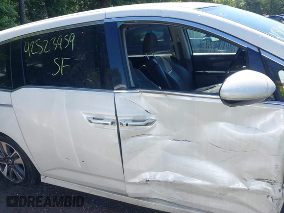 2014 Honda Odyssey Touring with VIN 5FNRL5H94EB071788, listed as a IAAI auction lot 42523959 with 244,734 mi miles and . Bid and sale history available at DreamBid. Image 13.