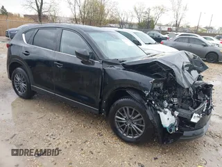 2020 Mazda CX-5 Touring z VIN JM3KFBCM5L0802234, wystawiony jako IAAI lot #42094637 z przebiegiem 70 570 mil mil oraz . Historia ofert i sprzedaży dostępna na DreamBid. Obrazek 1.