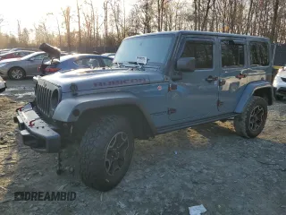 2015 Jeep Wrangler Unlimited Rubicon Hard Rock with VIN 1C4HJWFGXFL671660, listed as a Copart auction lot 82329074 with 214,579 mi miles and Salvage title. Bid and sale history available at DreamBid. Image 1.