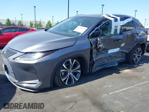 2022 Lexus RX 450h with VIN 2T2HGMDA4NC077617, listed as a IAAI auction lot 42489655 with 37,683 mi miles and . Bid and sale history available at DreamBid. Image 6.