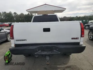 2000 GMC Sierra 1500 with VIN 1GTGC34R9YR154858, listed as a Copart auction lot 49158675 with 183,227 mi miles and Salvage Title. Bid and sale history available at DreamBid. Image 6.