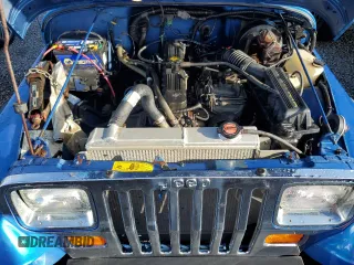 1992 Jeep Wrangler z VIN 2J4FY19P6NJ559597, wystawiony jako Copart lot #74990384 z przebiegiem 150 298 mil mil oraz Szkoda całkowita • Salvage title. Historia ofert i sprzedaży dostępna na DreamBid. Obrazek 11.