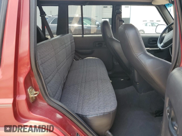 1999 Jeep Cherokee Sport with VIN 1J4FT68SXXL669549, listed as a Copart auction lot 62367015 with 194,446 mi miles and Salvage title. Bid and sale history available at DreamBid. Image 11.