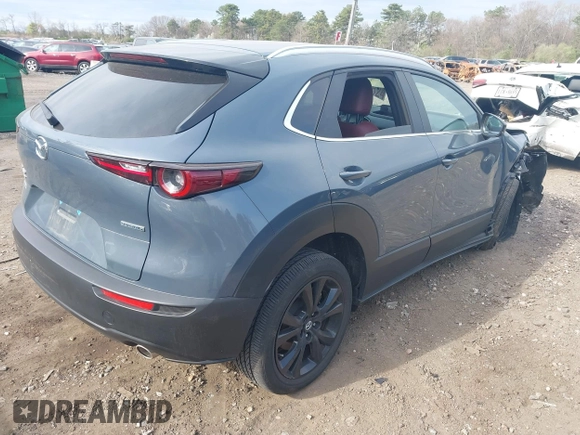 2023 Mazda CX-30 S Carbon Edition with VIN 3MVDMBCM8PM502891, listed as a IAAI auction lot 42050533 with 20,035 mi miles and . Bid and sale history available at DreamBid. Image 4.