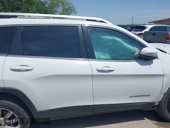 2015 Jeep Cherokee Limited with VIN 1C4PJLDS8FW566065, listed as a IAAI auction lot 42032563 with 181,937 mi miles and . Bid and sale history available at DreamBid. Image 12.