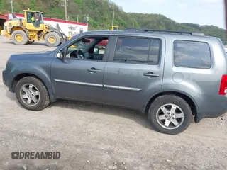 2011 Honda Pilot Touring with VIN 5FNYF4H90BB103824, listed as a IAAI auction lot 42127137 with 243,858 mi miles and . Bid and sale history available at carsss.com. Image 14.