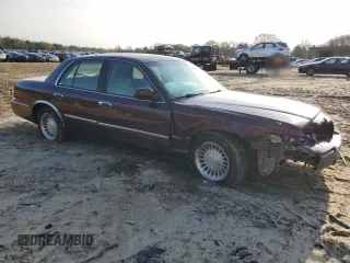 2001 Mercury Grand Marquis LS z VIN 2MEFM75W41X706118, wystawiony jako Copart lot #84484434 z przebiegiem 104 946 mil mil oraz Szkoda całkowita • Salvage title. Historia ofert i sprzedaży dostępna na DreamBid. Obrazek 4.