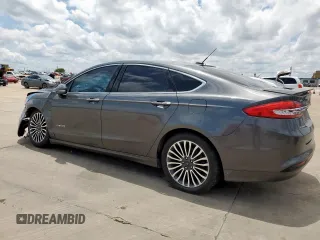2017 Ford Fusion Hybrid Titanium with VIN 3FA6P0RU1HR368930, listed as a Copart auction lot 64965075 with 180,607 mi miles and Clean title. Bid and sale history available at DreamBid. Image 2.