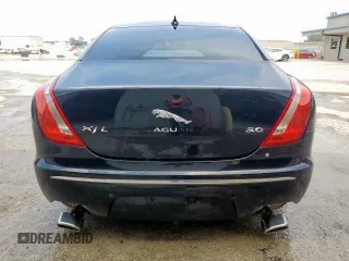 2014 Jaguar XJ Portfolio with VIN SAJWA2GZ2E8V64993, listed as a Copart auction lot 88774965 with 78,689 mi miles and Salvage title. Bid and sale history available at DreamBid. Image 6.