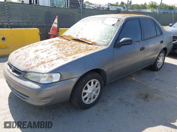 1999 Toyota Corolla VE z VIN 1NXBR12E5XZ237045, wystawiony jako IAAI lot #42413586 z przebiegiem Nie podano mil oraz . Historia ofert i sprzedaży dostępna na DreamBid. Obrazek 2.