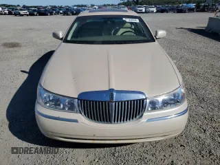 2001 Lincoln Town Car Cartier z VIN 1LNHM83W31Y671814, wystawiony jako Copart lot #77169664 z przebiegiem Nie podano mil oraz Szkoda całkowita • Salvage title. Historia ofert i sprzedaży dostępna na DreamBid. Obrazek 5.