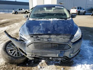 2018 Ford Focus Titanium z VIN 1FADP3N2XJL297048, wystawiony jako Copart lot #61579925 z przebiegiem 68 774 mil mil oraz Szkoda całkowita • Salvage title. Historia ofert i sprzedaży dostępna na DreamBid. Obrazek 5.