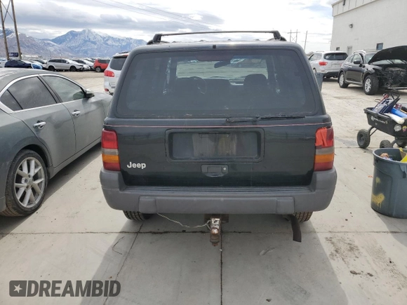 1996 Jeep Grand Cherokee with VIN 1J4EZ58S8TC106529, listed as a Copart auction lot 50163965 with 226,951 mi miles and Salvage title. Bid and sale history available at DreamBid. Image 6.