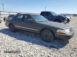 2003 Mercury Grand Marquis GS Convenience with VIN 2MEFM74W03X638534, listed as a Copart auction lot 49371535 with 335,360 mi miles and Salvage Title. Bid and sale history available at DreamBid. Image 4.