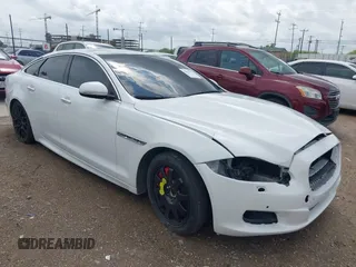2014 Jaguar XJ R with VIN SAJWA1EK3EMV58692, listed as a IAAI auction lot 42663979 with 111,386 mi miles and . Bid and sale history available at DreamBid. Image 1.
