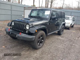 2015 Jeep Wrangler Unlimited Sahara with VIN 1C4HJWEG0FL661723, listed as a IAAI auction lot 41998393 with 89,077 mi miles. Bid and sale history available at carsss.com. Image 17.