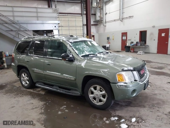 2004 GMC Envoy SLE with VIN 1GKDT13S842295715, listed as a IAAI auction lot 41602246 with 162,119 mi miles. Bid and sale history available at carsss.com. Image 1.