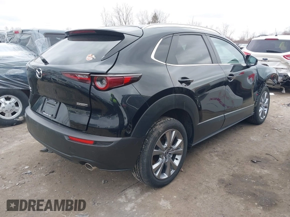 2023 Mazda CX-30 S Carbon Edition with VIN 3MVDMBCMXPM553129, listed as a IAAI auction lot 41864876 with 18,317 mi miles and . Bid and sale history available at DreamBid. Image 4.