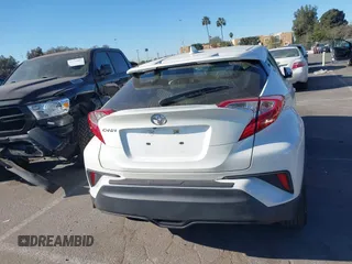 2019 Toyota C-HR XLE with VIN JTNKHMBX4K1058916, listed as a IAAI auction lot 41296963 with 113,290 mi miles. Bid and sale history available at carsss.com. Image 16.