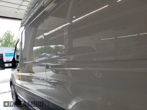 2023 Ford Transit Cargo with VIN 1FTBR1X86PKB99022, listed as a IAAI auction lot 42841650 with 14,234 mi miles and . Bid and sale history available at DreamBid. Image 10.